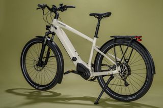 Specialized Turbo Vado 4.0 e-bike on an off yellow background