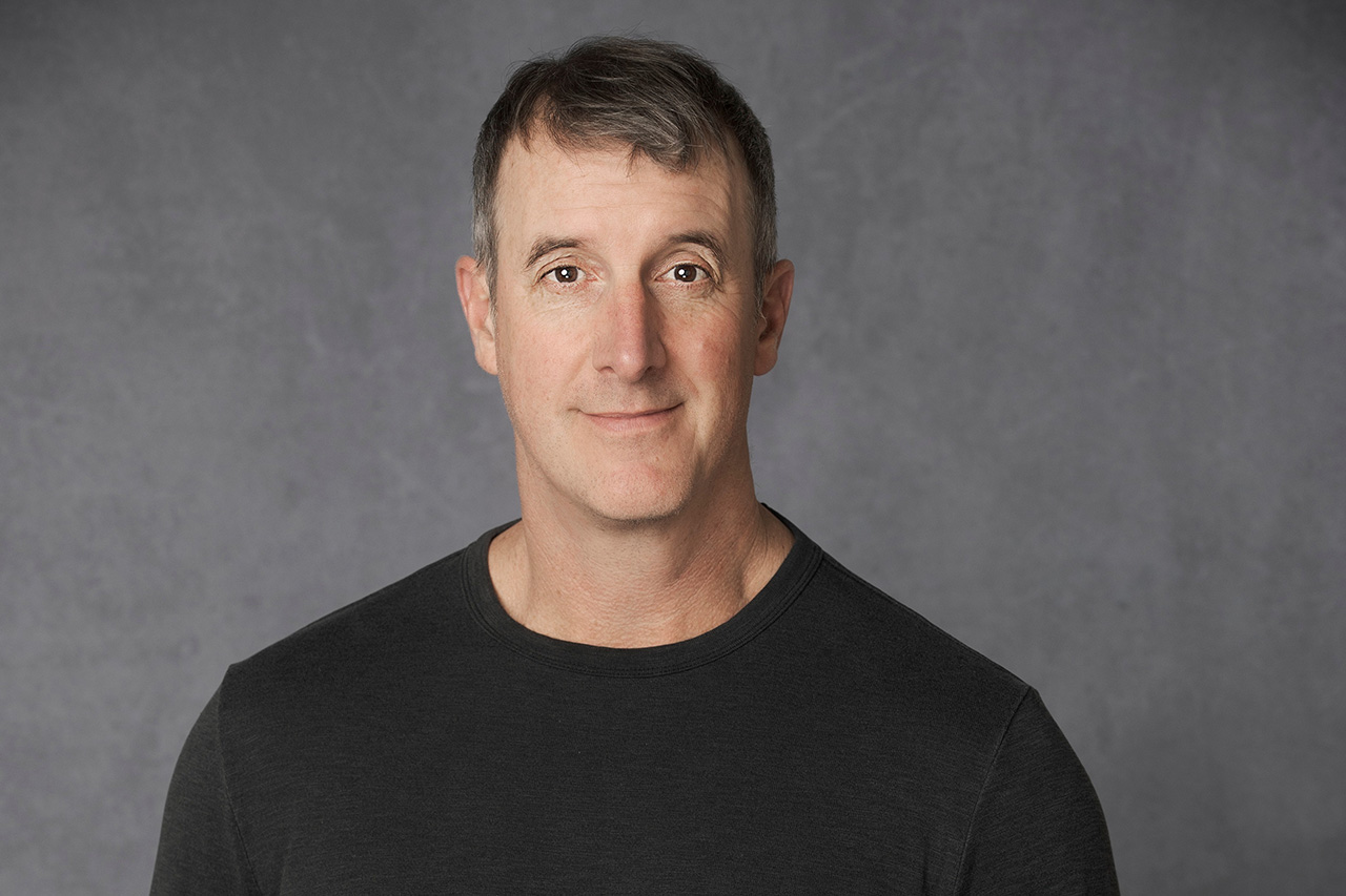 Smiling headshot of Gregory Hadden.