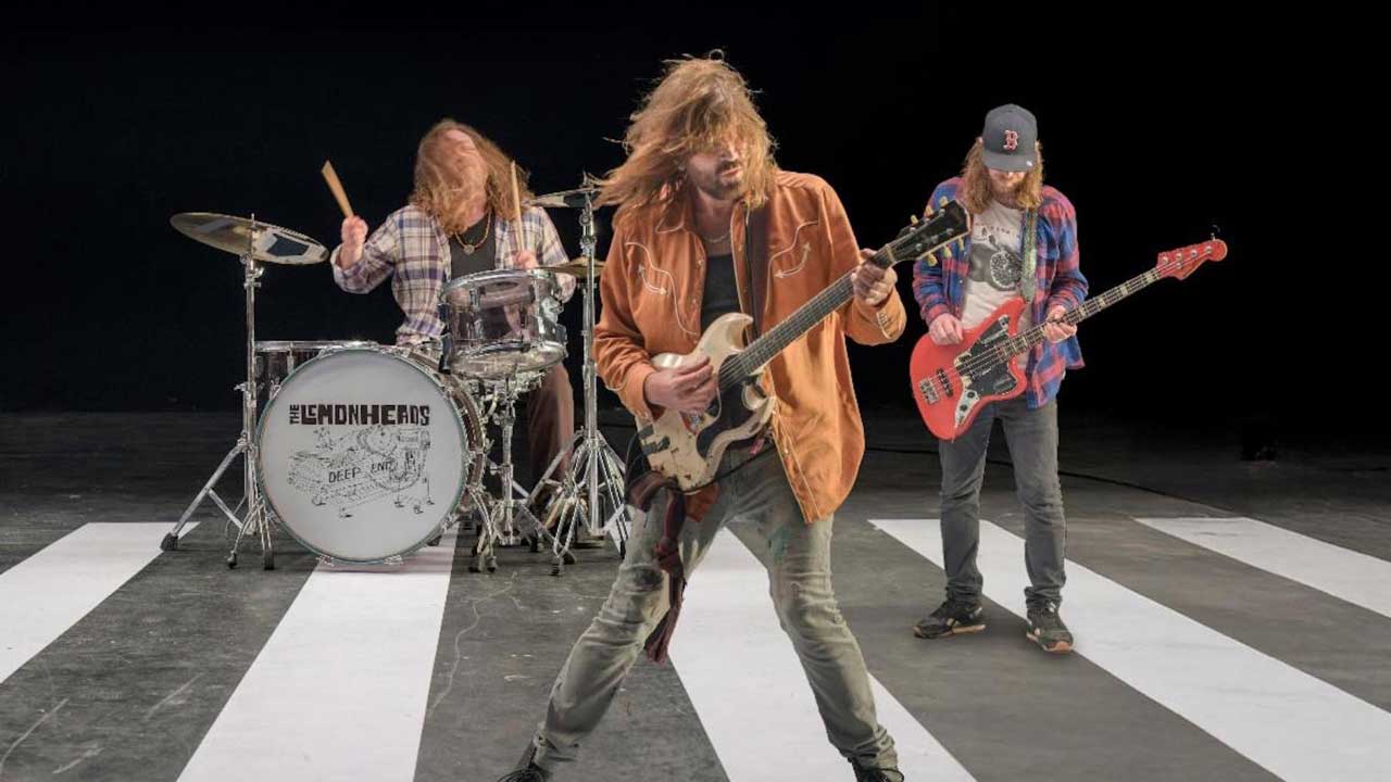 Lemonheads pretending to play on a pretend level crossing