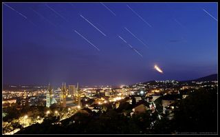 Night sky photographer shoots stunning image of Spica, Saturn, Mars and the Moon over the historic city of Pécs, Hungary.