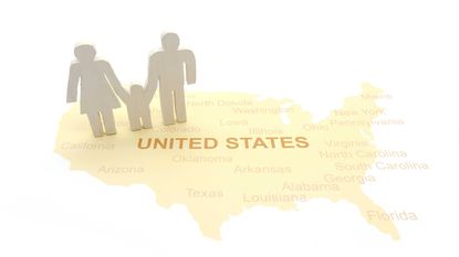 drawing of mother, father and child cutouts on a map of the United States