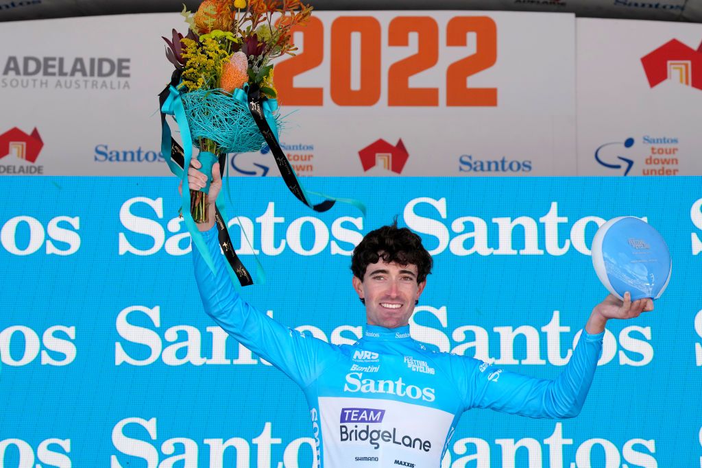WILLUNGA HILL AUSTRALIA JANUARY 29 James Whelan of Australia and Team Bridgelane celebrates winning the Blue Santos Leaders Jersey on the final podium ceremony after the 2nd Santos Festival Of Cycling 2022 Mens Elite Stage 3 a 1132km stage from McLaren Vale to Willunga Hill 224m TourDownUnder on January 29 2022 in Willunga Hill Australia Photo by Daniel KaliszGetty Images