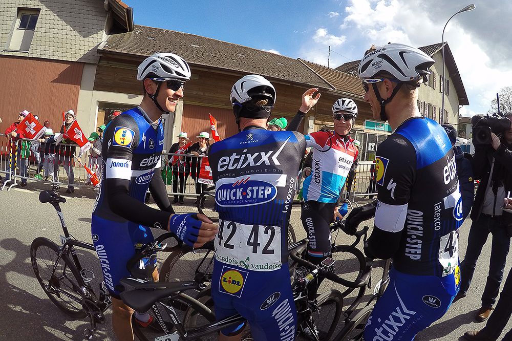 Etixx-QuickStep riders celebrate Kittel's win after stage 1 at Tour de Romandie.
