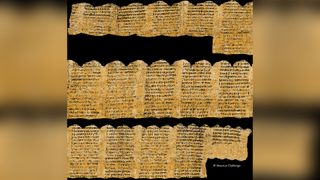 A physically unrolled scroll with golden background and black text.
