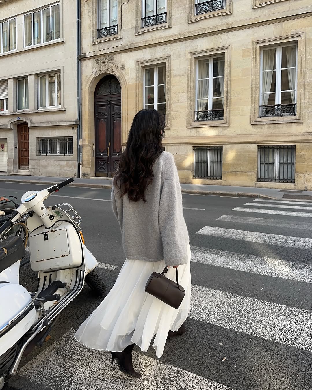 woman wearing suede pointed toe ankle boots trend 2025