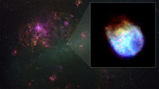 a blue, purple and reddish-orange supernova remnant shines against the blackness of space