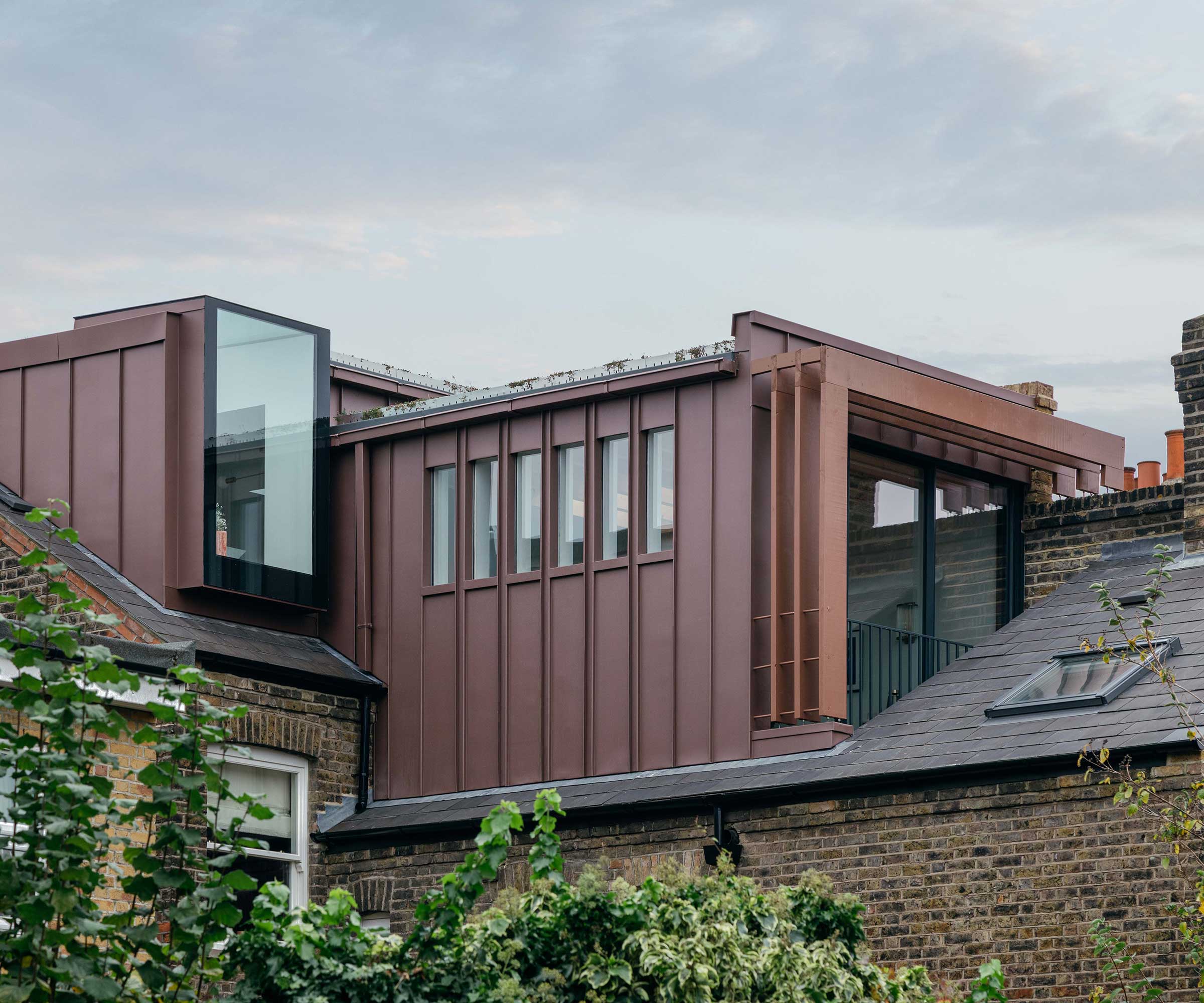 modern loft conversion with red zinc cladding