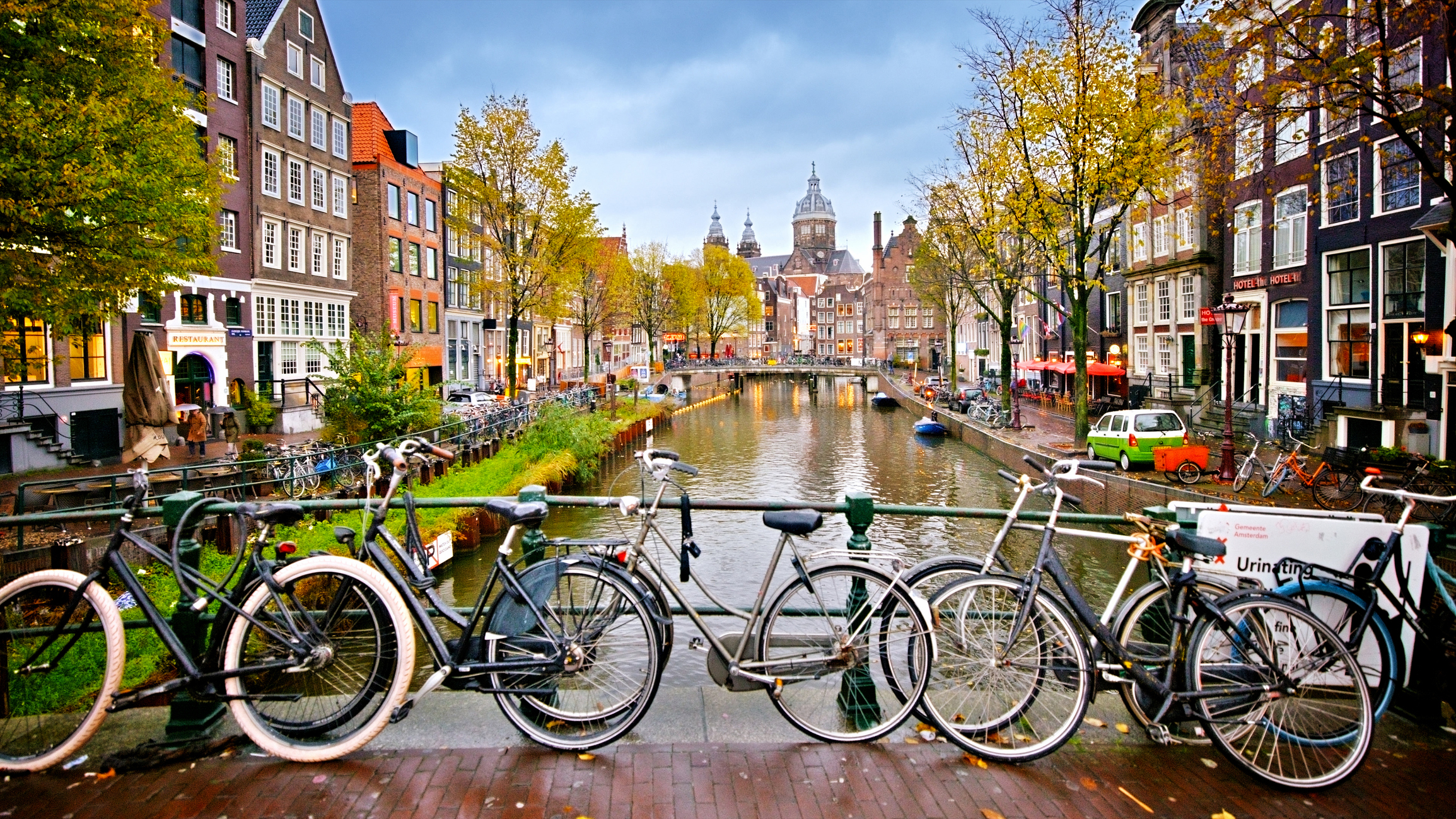 View of canal in Amsterdam, Holland. Amstel river, canal, and bicycles
