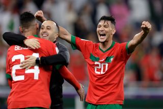 Achraf Dari of Morocco celebrates the victory during the World Cup match against Portugal at Qatar 2022.