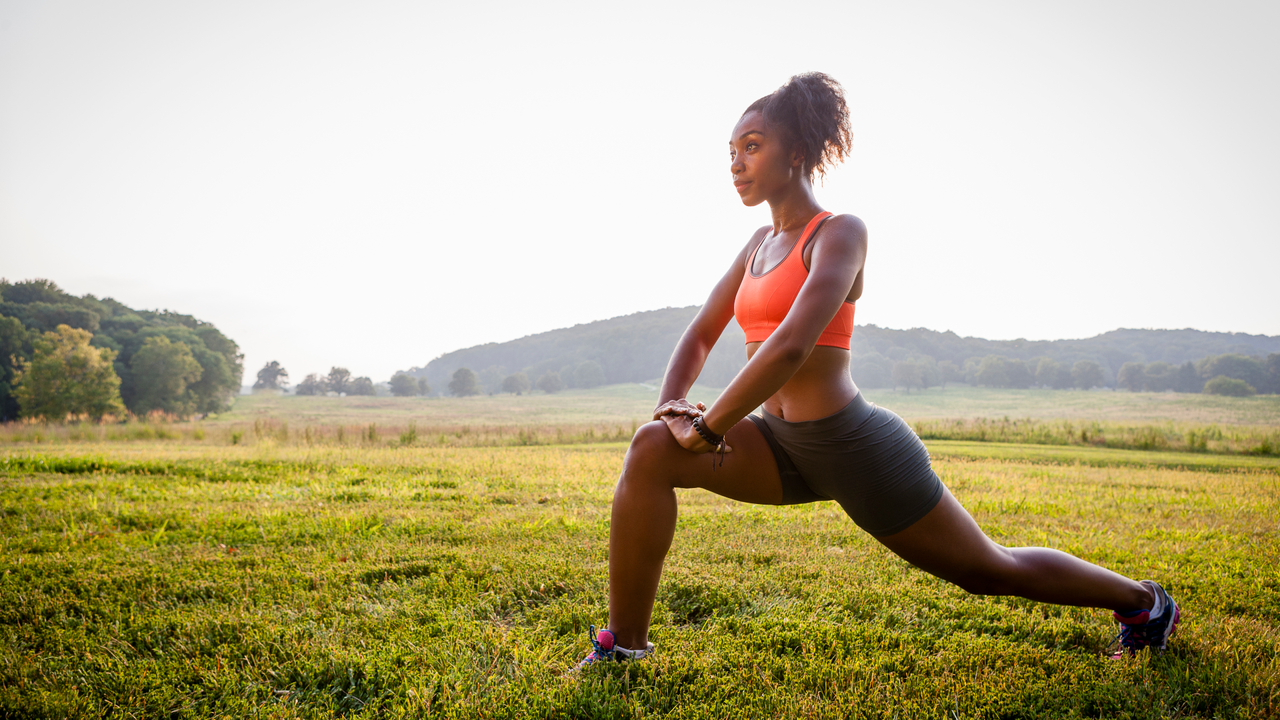 Woman doing a stretch after a run