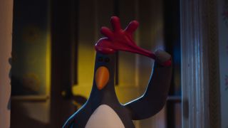 Feathers McGraw yanks off his rubber glove cap in Wallace & Gromit: Vengeance Most Fowl.