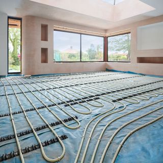 Underfloor heating wires in a room being renovated