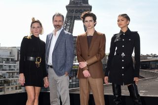 Swedish actress Rebecca Ferguson, French-Canadian director Denis Villeneuve, US actor Timothee Chalamet and US actress Zendaya pose during a photocall session for the American epic science-fiction movie "Dune" in Paris