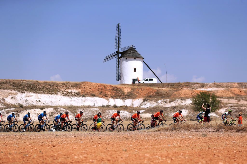 ALBACETE SPAIN AUGUST 18 LR Juan Jose Lobato Del Valle of Spain Mikel Iturria Segurola of Spain Antonio Jess Soto Guirao of Spain and Team Euskaltel Euskadi Kevin Van Melsen of Belgium Simone Petilli of Italy and Team Intermarch Wanty Gobert Matriaux and general view of the Peloton passing through a windmill field during the 76th Tour of Spain 2021 Stage 5 a 1844km stage from Tarancn to Albacete lavuelta LaVuelta21 on August 18 2021 in Albacete Spain Photo by Gonzalo Arroyo MorenoGetty Images