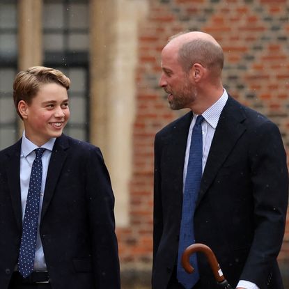 Prince George and Prince William smiling at each other
