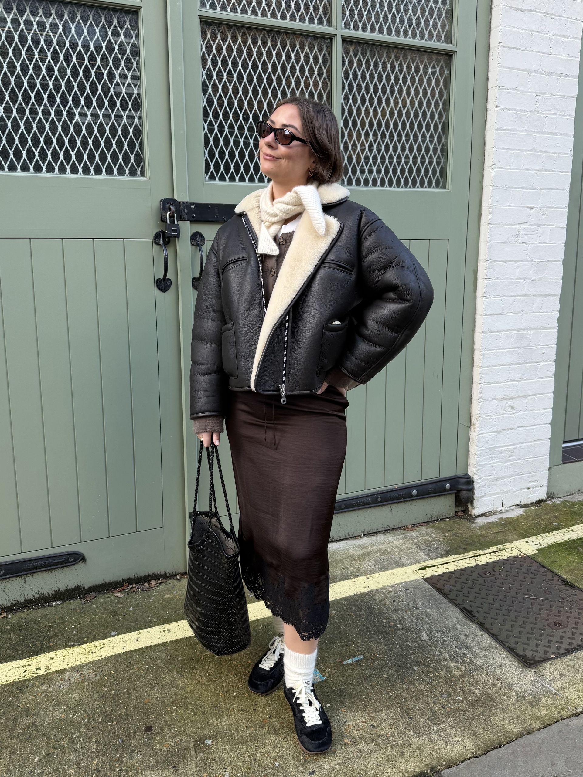 An image of Who What Wear UK fashion editor Sophie Robyn Watson wearing a lace-trim satin skirt from The White Company.