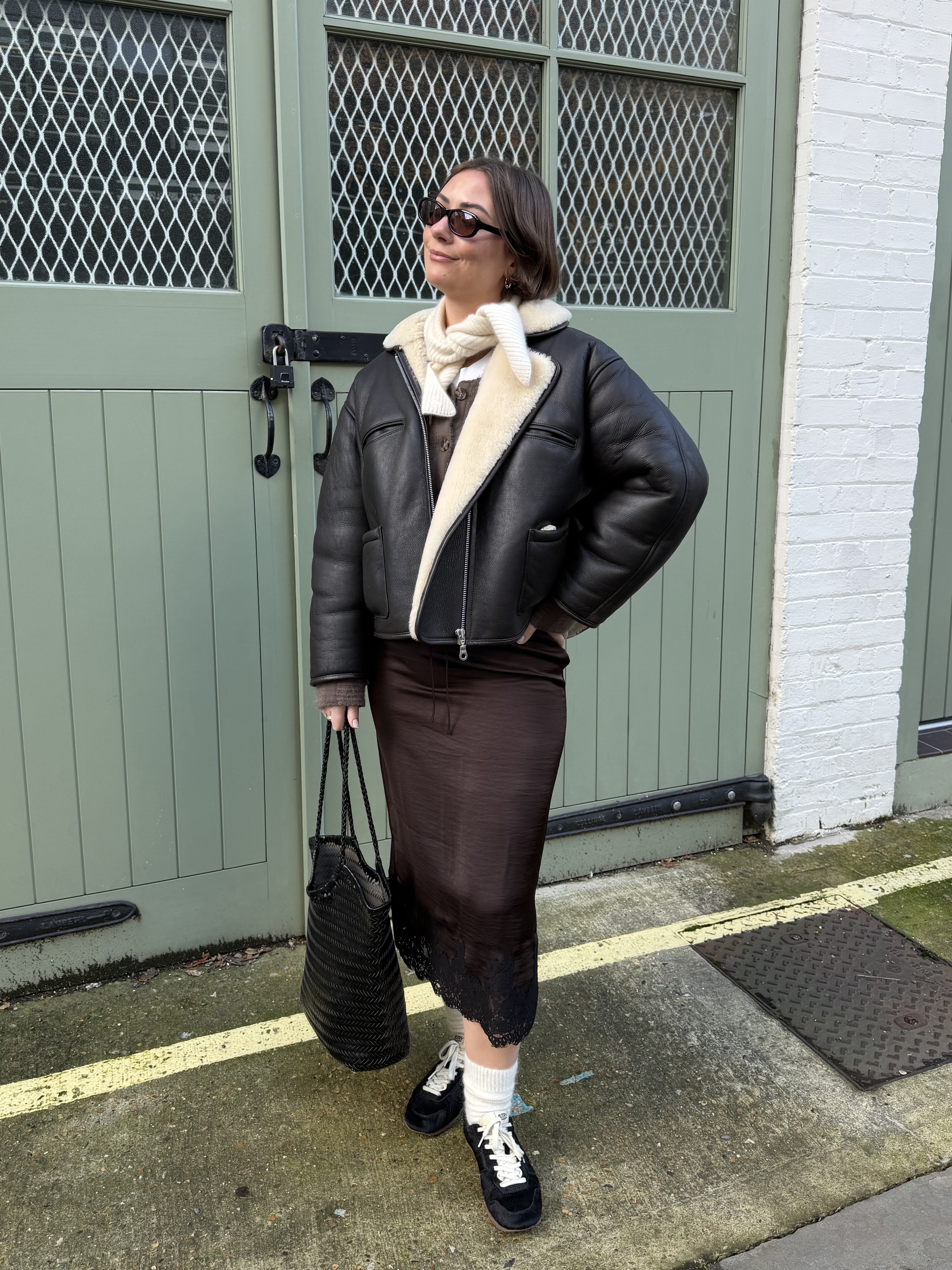 An image of Who What Wear UK fashion editor Sophie Robyn Watson wearing a lace-trim satin skirt from The White Company.