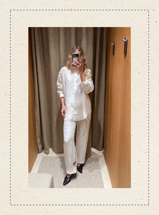 Eliza Huber in the dressing room at Massimo Dutti's new Miami store wearing a white plisse button down shirt with matching pants.