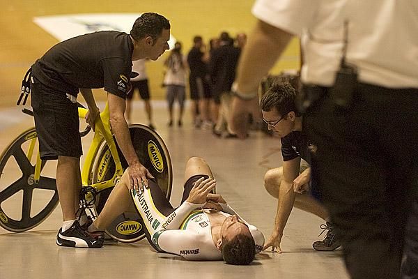 The bird has flown: Australian rider Alex Bird lies on the apron at Hisense Arena after crashing in the home straight during a round of the keirin.