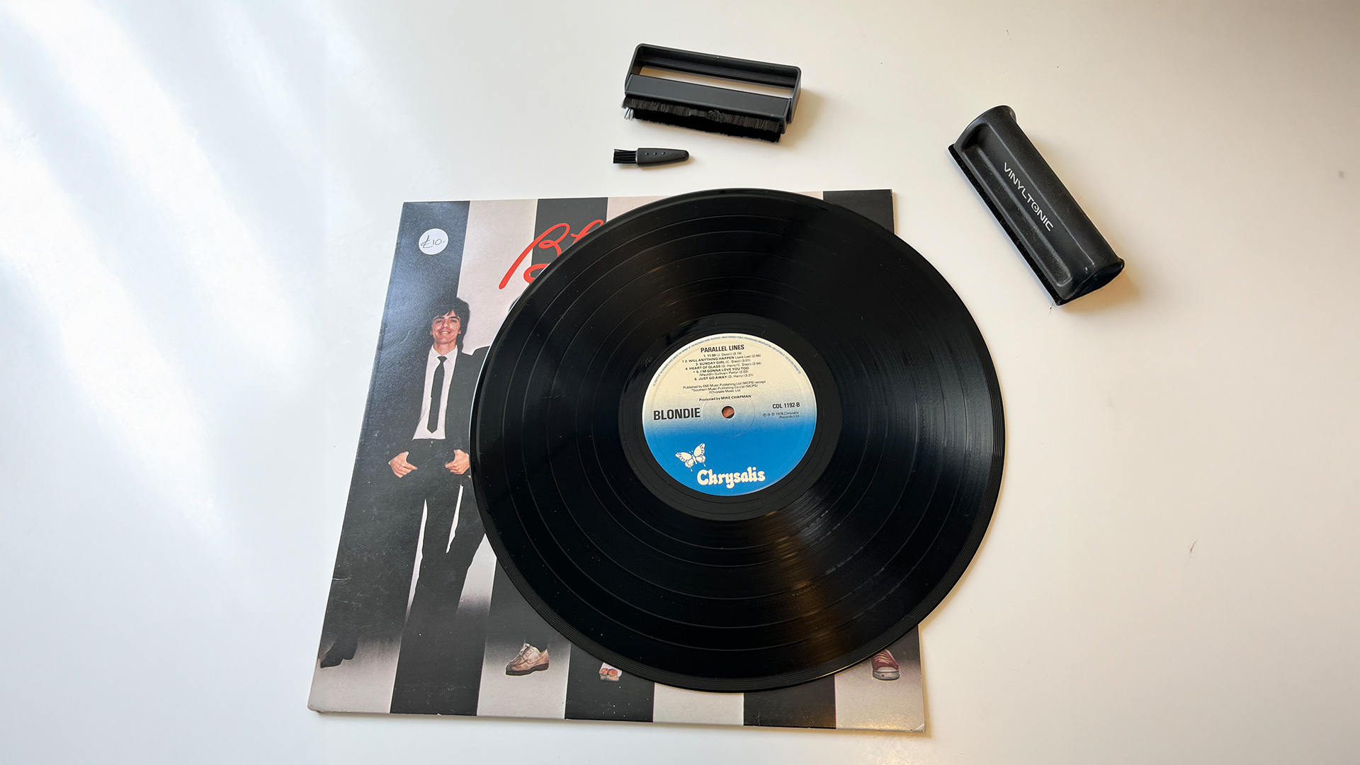 Vinyl record cleaning showing Blondie record and anti-static brush