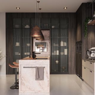 A kitchen with an island and a pantry with reeded glass doors