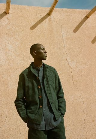 A model in dark green clothes