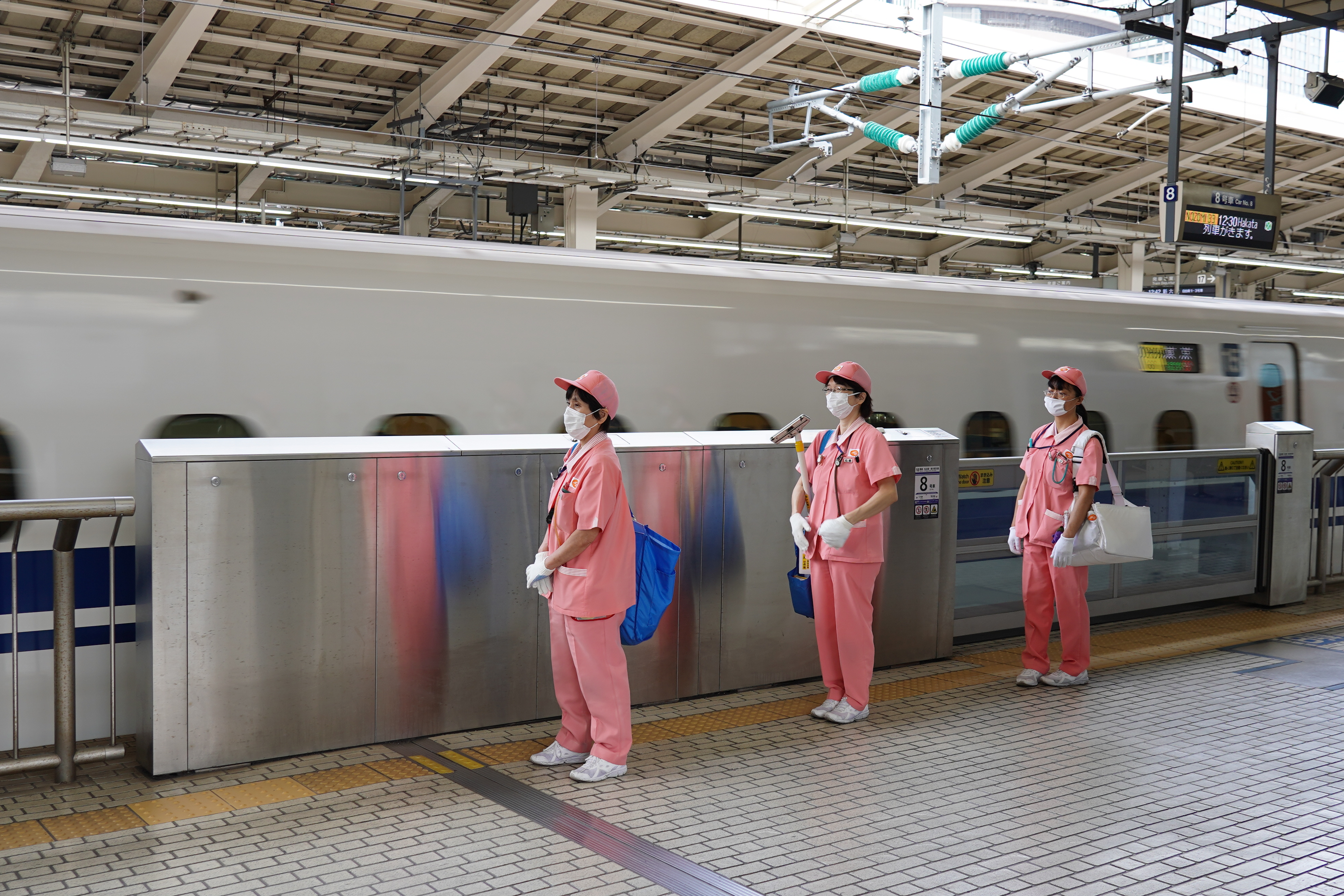 Cleaners outside the Shinkansen