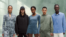 Five models stand in a yoga studio setting wearing Lululemon clothes