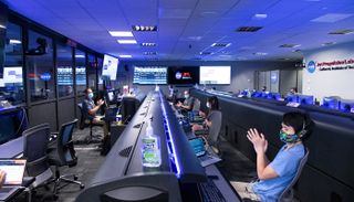 The Mars 2020 navigation team celebrates Perseverance's second trajectory correction maneuver in the Mission Support Area at NASA's Jet Propulsion Laboratory in Pasadena, California, on Sept. 30, 2020.