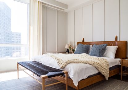 Apartment bedroom with panelled walls