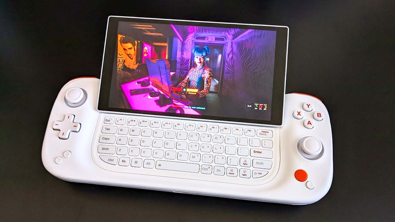 Image of the AYANEO Slide playing Cyberpunk 2077, but with the screen slid up to reveal a full keyboard.