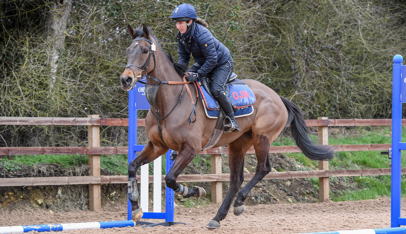 Laura Collett cantering a racehorse