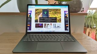 Microsoft Surface Laptop 5 review: laptop on wooden side table