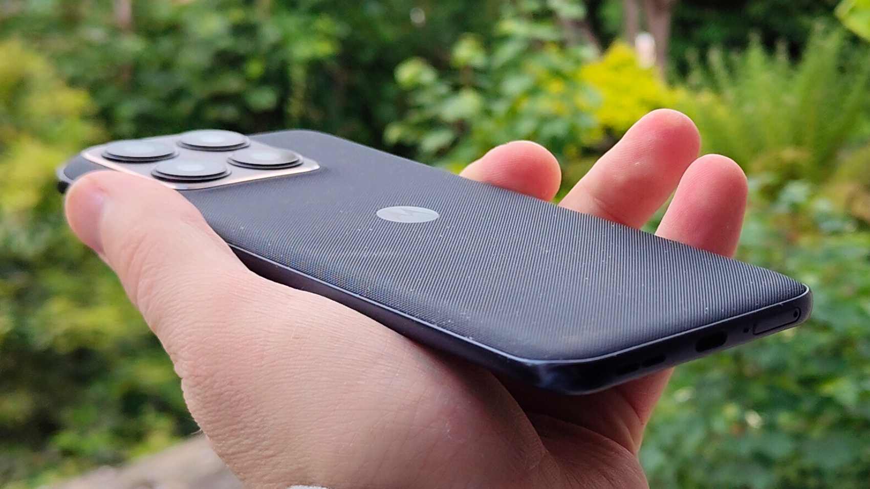 The Motorola Edge 70 Fusion angled in a man's hand.