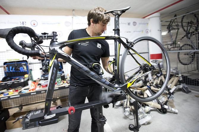 Mechanic Alan Dumic assembles a Fuji bike