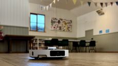 Dreame L40 Ultra robot vacuum in a village hall