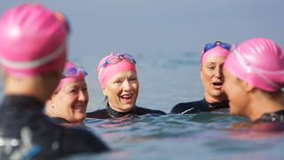 Group of women swimmers enjoying the benefits of exercise over 50