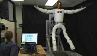 NASA's Robonaut 2 flexes its newly built legs in this still from a video demonstration of the robot's new capabilities released Dec. 9, 2013.