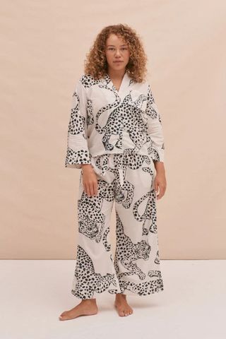 valentine's gifts for her - woman wearing jaguar print wide leg pyjama bottoms and button down shirt