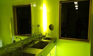 washroom with lime green light