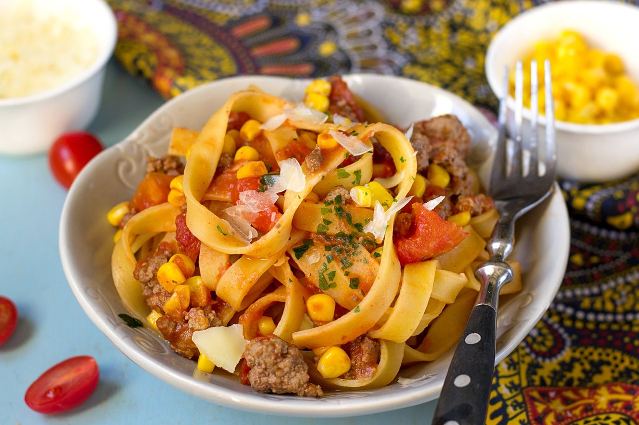 Plate of chicken bolognese with sweetcorn