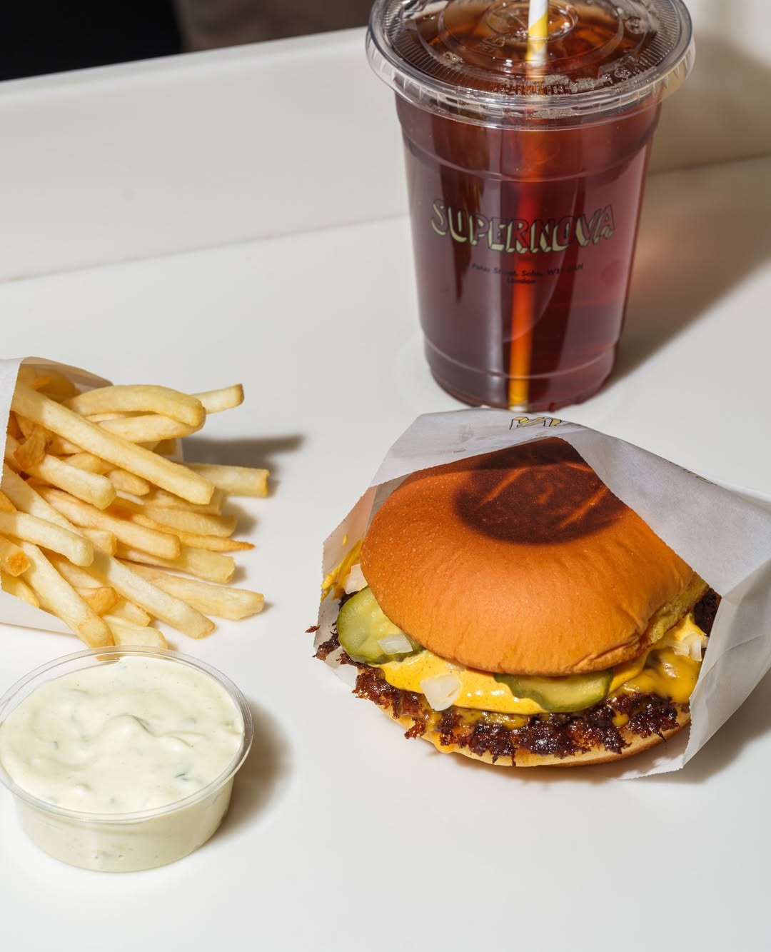 supernova house burger fries soft drink