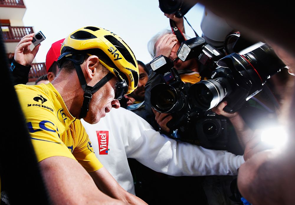 Chris Froome is mobbed at the finish of stage 20.