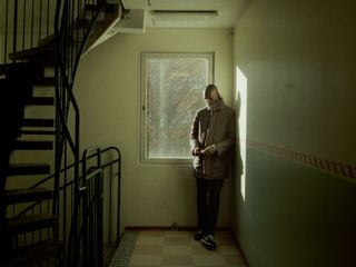 man in a stairwell in a swedish high rise building