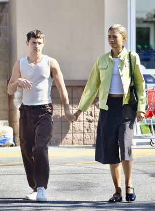 Tom Holland and Zendaya walk in Los Angeles wearing matching white tank tops