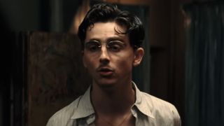 A close up of Timothee Chalamet wearing glasses in Marty Supreme