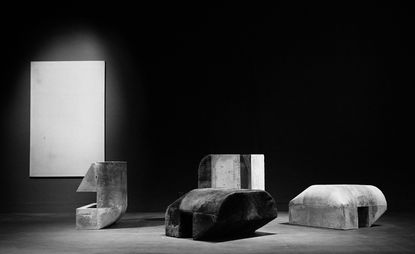 Black and white image of large-scale concrete sculptures