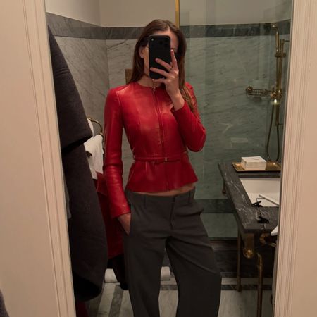 eliza huber wearing red fitted leather jacket
