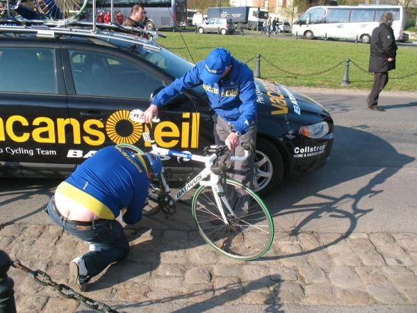 A Vacansoleil mechanic does some last-minute fine-tuning to a race bike