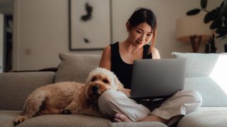 Woman on couch with dog